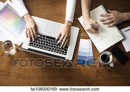 Project team members working side by side View Large Photo Image Stock Photo - Project team members working side by side. Fotosearch