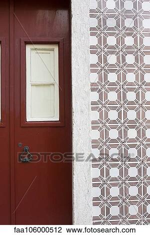 Red door and ornate tiled wall View Large Photo Image Stock Image - Red door and ornate tiled wall. Fotosearch