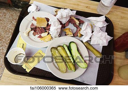 Stock Photography - Remnants of deli sandwich on tray. Fotosearch