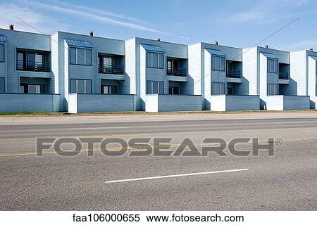 Stock Photography - Row of identical apartments along street. Fotosearch