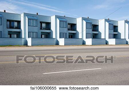Row of identical apartments along street View Large Photo Image Stock Photography - Row of identical apartments along street. Fotosearch