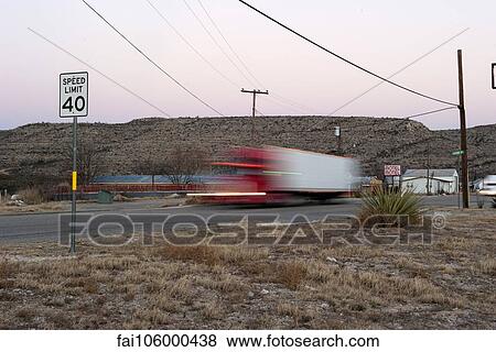 Semi-truck moving on highway View Large Photo Image Stock Photo - Semi-truck moving on highway. Fotosearch