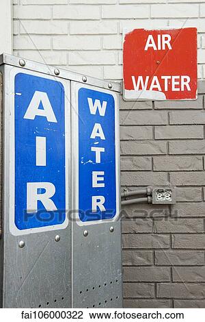 Signs advertising air and water pumps View Large Photo Image Stock Image - Signs advertising air and water pumps. Fotosearch