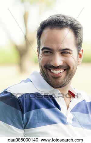 Stock Image - Spending time outdoors with friends. Fotosearch