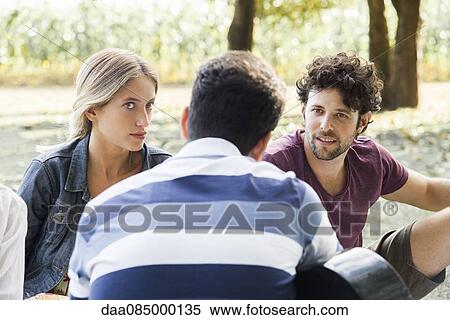 Spending time outdoors with friends View Large Photo Image Stock Photography - Spending time outdoors with friends. Fotosearch