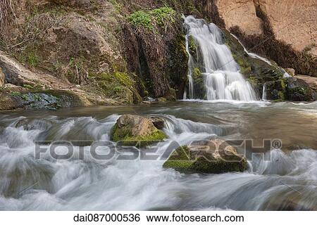 Stream flowing over rocks in Zion National Park, Utah, USA View Large Photo Image Stock Photograph - Stream flowing over rocks in Zion National Park, Utah, USA. Fotosearch