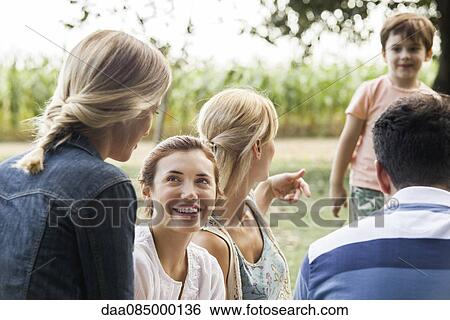 Summer picnic in the park with family and friends View Large Photo Image Stock Photograph - Summer picnic in the park with family and friends. Fotosearch