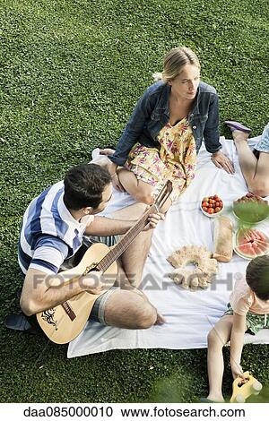 Summer picnic in the park with friends View Large Photo Image Stock Image - Summer picnic in the park with friends. Fotosearch