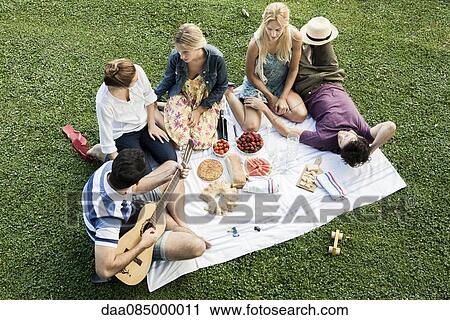Summer picnic in the park with friends View Large Photo Image Stock Image - Summer picnic in the park with friends. Fotosearch