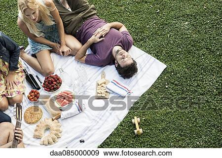 Summer picnic in the park with friends View Large Photo Image Stock Photo - Summer picnic in the park with friends. Fotosearch
