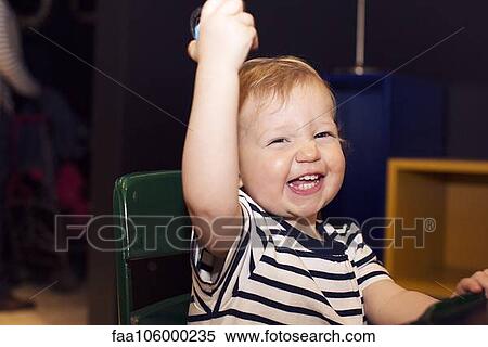 Toddler bursting out laughing View Large Photo Image Stock Photography - Toddler bursting out laughing. Fotosearch