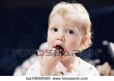 Toddler licking chocolate syrup from fingers View Large Photo Image Stock Photography - Toddler licking chocolate syrup from fingers. Fotosearch