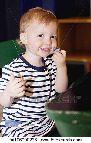 Stock Photograph - Toddler, portrait. Fotosearch