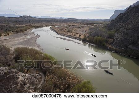 Tourists canoeing on the Rio Grande in Big Bend National Park, Texas, USA View Large Photo Image Stock Photo - Tourists canoeing on the Rio Grande in Big Bend National Park, Texas, USA. Fotosearch