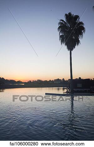 Stock Image - Tranquil sunset over lake. Fotosearch