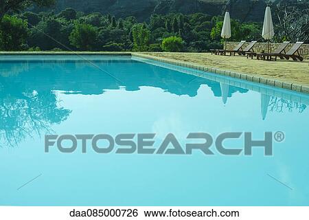 Tranquil swimming pool View Large Photo Image Stock Photograph - Tranquil swimming pool. Fotosearch