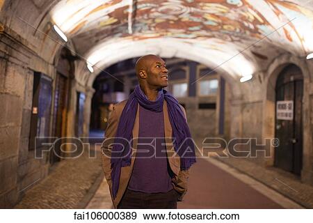 Traveler admiring graffiti on ceiling View Large Photo Image Stock Photo - Traveler admiring graffiti on ceiling. Fotosearch