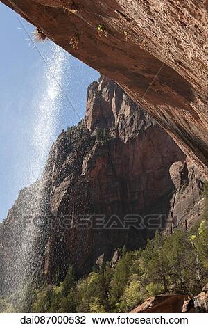 Underside of waterfall in Zion National Park, Utah, USA View Large Photo Image Stock Image - Underside of waterfall in Zion National Park, Utah, USA. Fotosearch