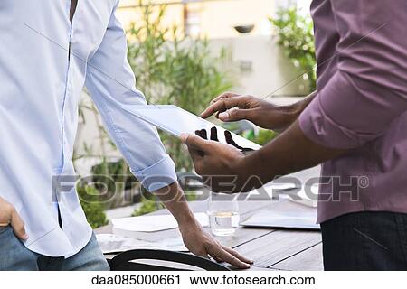Using digital tablet View Large Photo Image Stock Image - Using digital tablet. Fotosearch