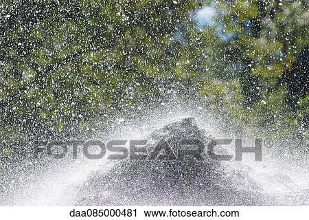 Water splashing over rock View Large Photo Image Stock Image - Water splashing over rock. Fotosearch