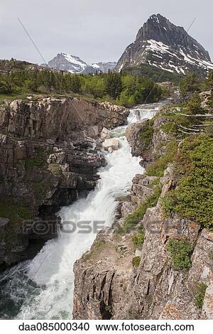 Stock Image - Waterfall in Glacier National Park, Montana, USA. Fotosearch