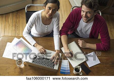 Wireless devices make planning home improvement projects easy View Large Photo Image Stock Image - Wireless devices make planning home improvement projects easy. Fotosearch