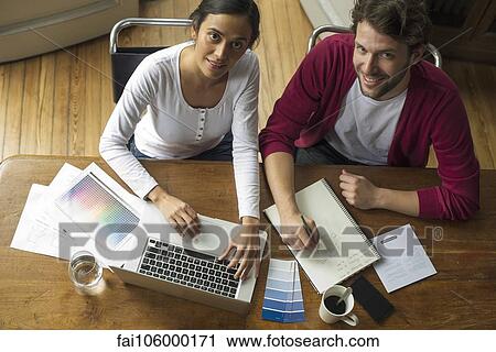 Wireless devices make planning home improvement projects easy View Large Photo Image Stock Image - Wireless devices make planning home improvement projects easy. Fotosearch