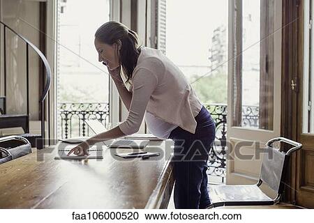 Woman at home making phone call View Large Photo Image Stock Image - Woman at home making phone call. Fotosearch