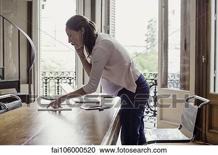 Woman at home making phone call View Large Photo Image Stock Image - Woman at home making phone call. Fotosearch