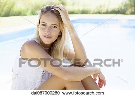 Woman at poolside, portrait View Large Photo Image Stock Image - Woman at poolside, portrait. Fotosearch