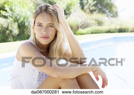 Woman at poolside, portrait View Large Photo Image Stock Image - Woman at poolside, portrait. Fotosearch