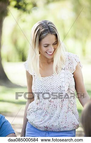 Woman chatting with friends View Large Photo Image Picture - Woman chatting with friends. Fotosearch