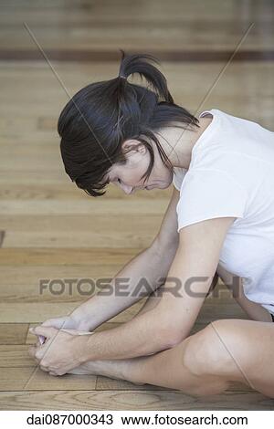 Woman doing stretches View Large Photo Image Stock Image - Woman doing stretches. Fotosearch