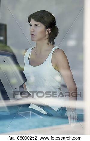 Woman exercising in fitness club View Large Photo Image Stock Image - Woman exercising in fitness club. Fotosearch