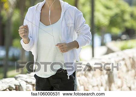 Woman jogging, cropped View Large Photo Image Stock Image - Woman jogging, cropped. Fotosearch