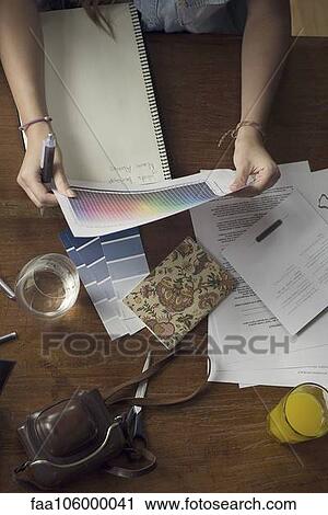Woman looking at color spectrum sheet View Large Photo Image Stock Image - Woman looking at color spectrum sheet. Fotosearch