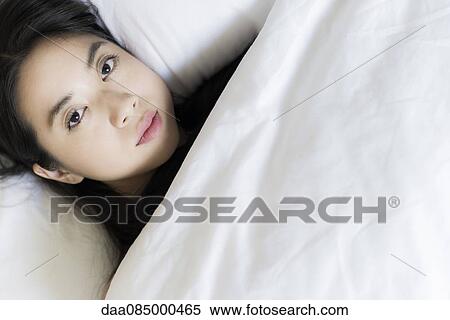 Woman lying awake in bed View Large Photo Image Stock Photography - Woman lying awake in bed. Fotosearch