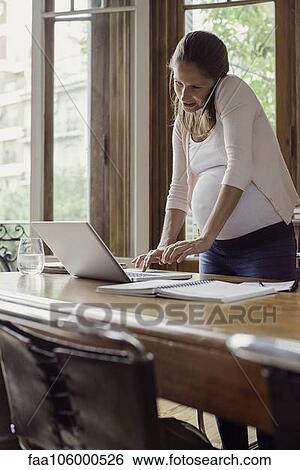 Stock Photograph - Woman multitasking. Fotosearch