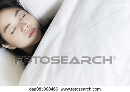 Woman sleeping in bed View Large Photo Image Stock Photograph - Woman sleeping in bed. Fotosearch