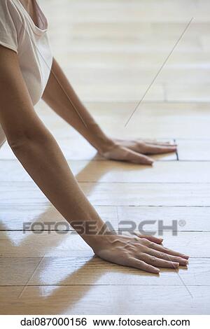 Woman stretching in cobra pose, cropped View Large Photo Image Stock Photograph - Woman stretching in cobra pose, cropped. Fotosearch
