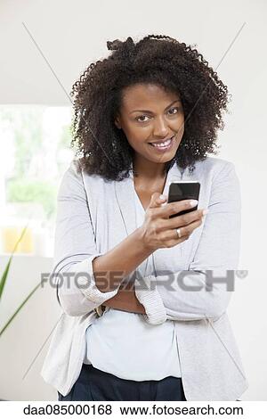 Woman text messaging View Large Photo Image Stock Photo - Woman text messaging. Fotosearch