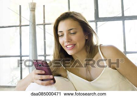 Woman using smartphone View Large Photo Image Stock Image - Woman using smartphone. Fotosearch