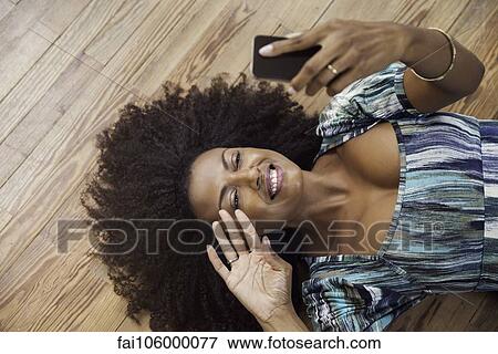 Stock Photo - Woman video chatting with friend. Fotosearch