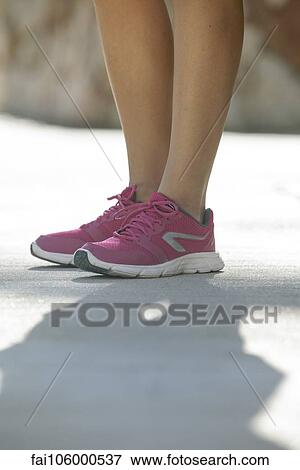 Woman wearing sport shoes, cropped View Large Photo Image Stock Photo - Woman wearing sport shoes, cropped. Fotosearch