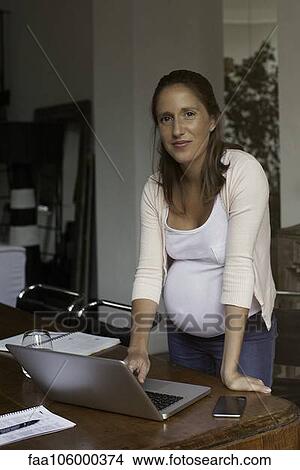 Picture - Woman working from home, portrait. Fotosearch