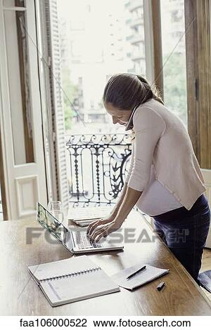 Woman working from home View Large Photo Image Stock Image - Woman working from home. Fotosearch