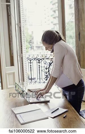 Woman working from home View Large Photo Image Stock Image - Woman working from home. Fotosearch
