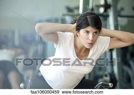 Woman working out in health club View Large Photo Image Stock Photo - Woman working out in health club. Fotosearch