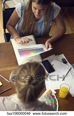 Women considering color swatches View Large Photo Image Stock Photograph - Women considering color swatches. Fotosearch
