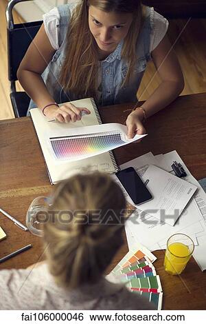 Women considering color swatches View Large Photo Image Stock Photograph - Women considering color swatches. Fotosearch
